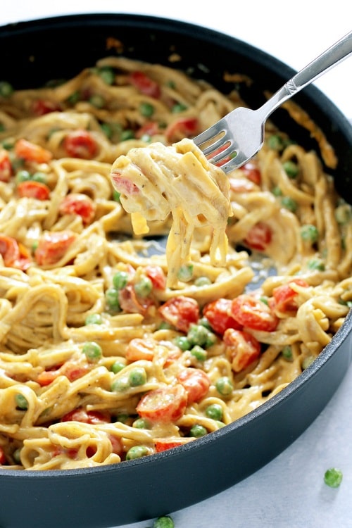 One Pot Vegan Fettuccine Alfredo with Peas and Roasted Cherry Tomatoes